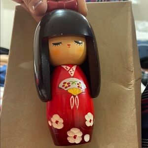 Authentic Chie Kokeshi Doll with red kimono, cherry blossom, mid size.